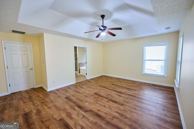 3350 Cooper Woods Dr, Loganville, GA 30052 - unfurnished room with a raised ceiling, ceiling fan, wood finished floors, and baseboards