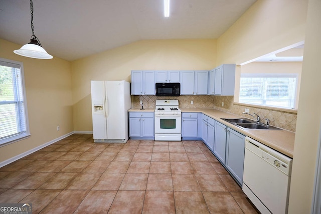 3350 Cooper Woods Dr, Loganville, GA 30052 - kitchen with white appliances, a sink, lofted ceiling, tasteful backsplash, and light countertops