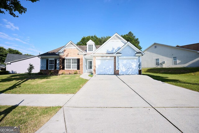 3350 Cooper Woods Dr, Loganville, GA 30052 - traditional home with concrete driveway, brick siding, a front yard, and a garage