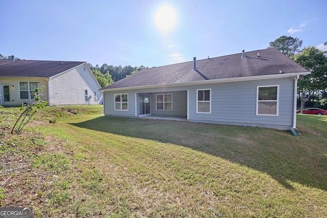 3350 Cooper Woods Dr, Loganville, GA 30052 - back of house with a lawn and a patio area
