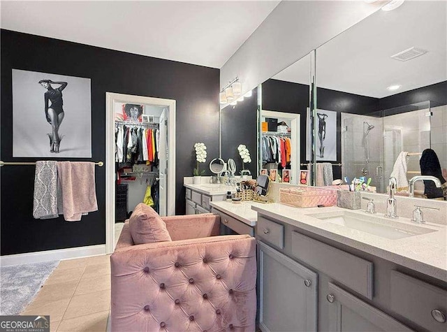 1127 Provence Ln, Decatur, GA 30033 - bathroom featuring a shower stall, a walk in closet, vanity, and tile patterned flooring