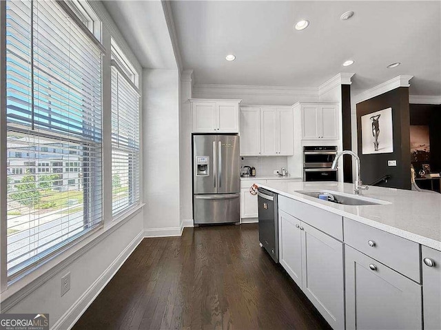 1127 Provence Ln, Decatur, GA 30033 - kitchen featuring appliances with stainless steel finishes, a sink, plenty of natural light, light countertops, and ornamental molding