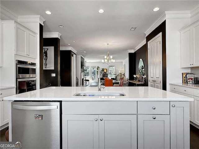 1127 Provence Ln, Decatur, GA 30033 - kitchen with stainless steel appliances, a chandelier, light countertops, a sink, and recessed lighting
