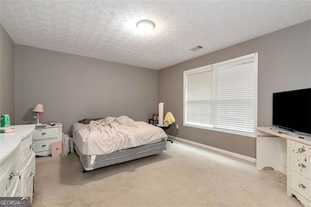 3265 Watson Gate Rd, Loganville, GA 30052 - bedroom featuring light colored carpet, a textured ceiling, and baseboards