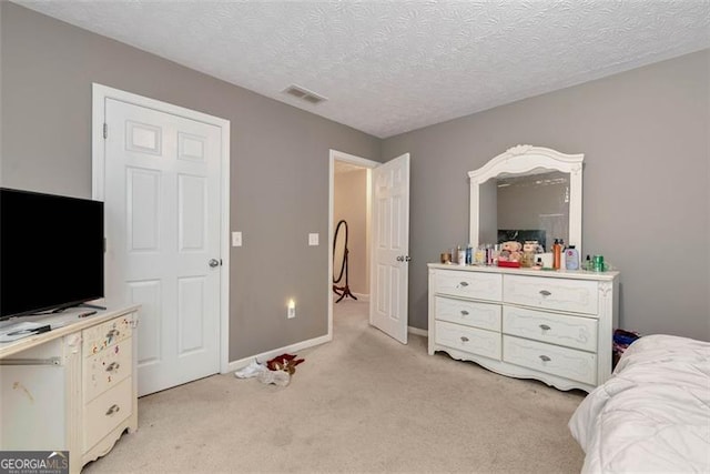 3265 Watson Gate Rd, Loganville, GA 30052 - bedroom with light colored carpet and a textured ceiling