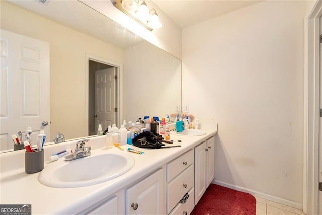 3265 Watson Gate Rd, Loganville, GA 30052 - bathroom with tile patterned flooring, double vanity, and baseboards