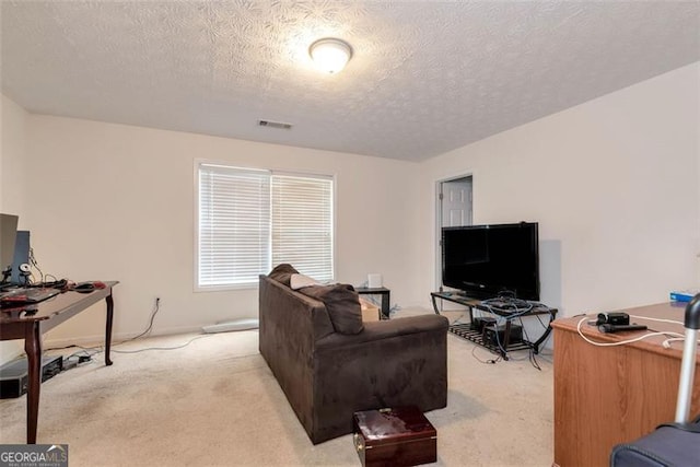 3265 Watson Gate Rd, Loganville, GA 30052 - living room with light carpet, a desk, and a textured ceiling
