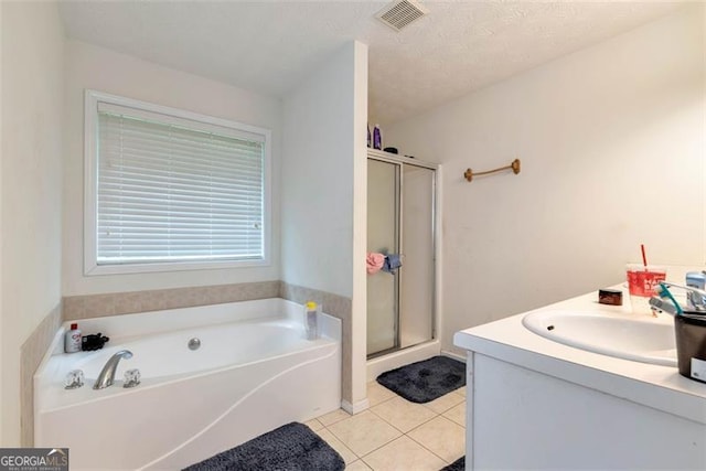 3265 Watson Gate Rd, Loganville, GA 30052 - bathroom featuring tile patterned flooring, a stall shower, a garden tub, and vanity