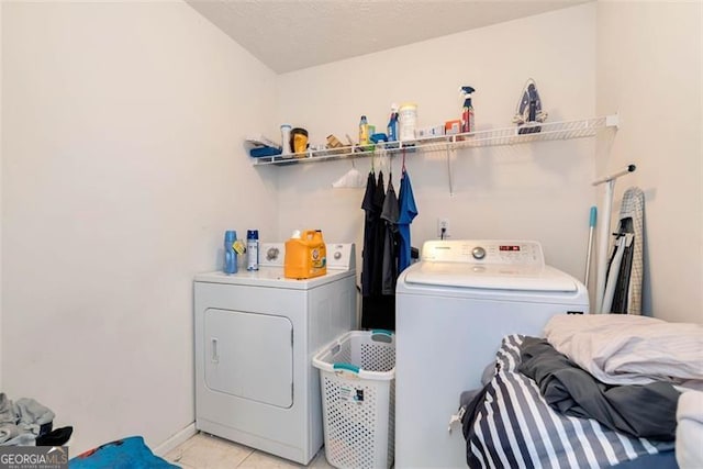 3265 Watson Gate Rd, Loganville, GA 30052 - laundry room with independent washer and dryer and light tile patterned floors