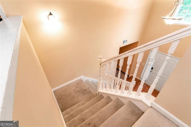 3265 Watson Gate Rd, Loganville, GA 30052 - stairway featuring carpet and baseboards