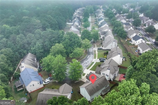 3265 Watson Gate Rd, Loganville, GA 30052 - aerial view of residential area featuring a heavily wooded area