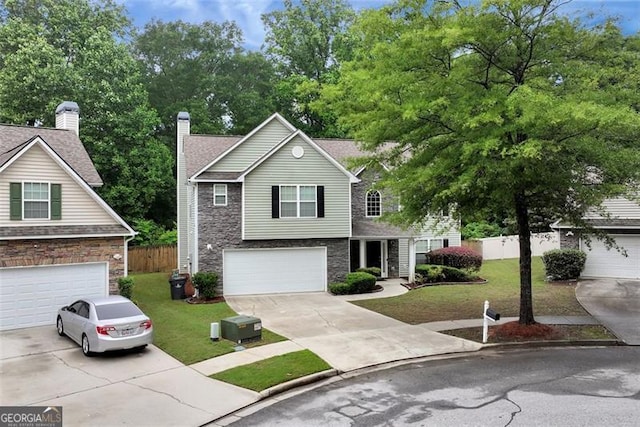 3265 Watson Gate Rd, Loganville, GA 30052 - traditional-style house with stone siding, driveway, an attached garage, and a chimney