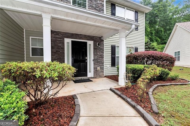 3265 Watson Gate Rd, Loganville, GA 30052 - entrance to property with stone siding and a porch