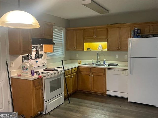 248 Dreamland Cir, Winder, GA 30680 - kitchen with white appliances, a sink, under cabinet range hood, wood finished floors, and light countertops