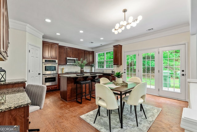 3153 Daleview Way SW, Atlanta, GA 30331 - dining room with crown molding, light wood-type flooring, recessed lighting, and a chandelier