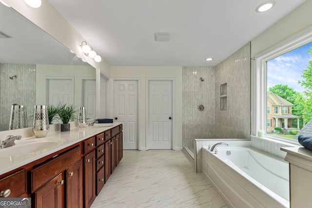 3153 Daleview Way SW, Atlanta, GA 30331 - bathroom with a tile shower, healthy amount of natural light, a bath, double vanity, and recessed lighting