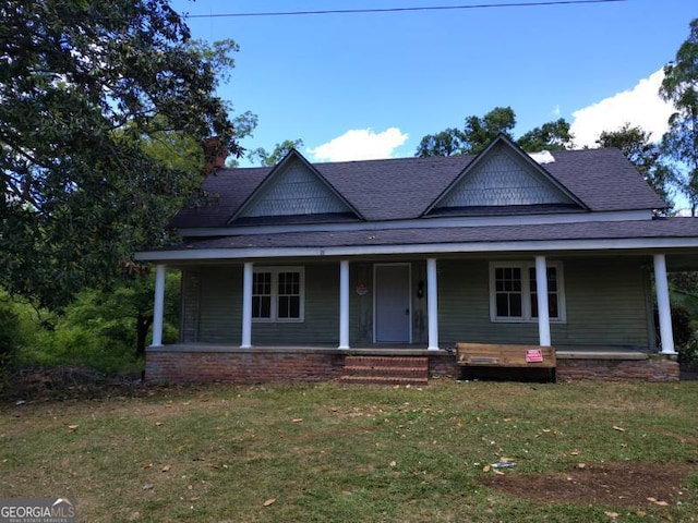 2005 Thairdell Rd, Rockledge, GA 30454 - farmhouse-style home with a front yard, roof with shingles, and a porch
