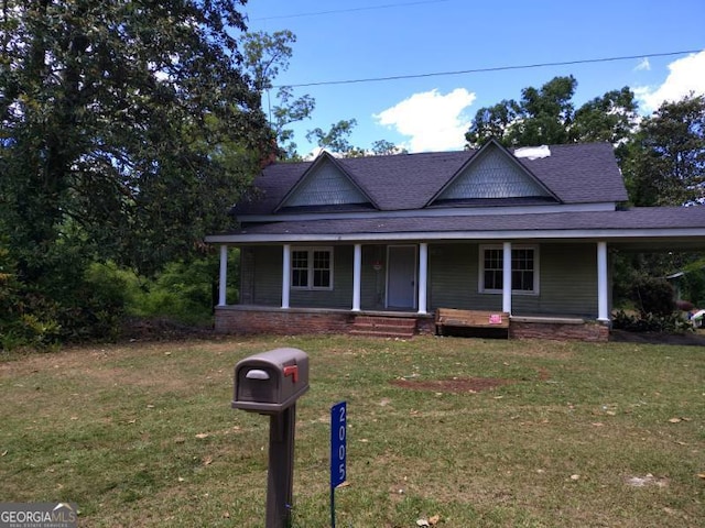 2005 Thairdell Rd, Rockledge, GA 30454 - country-style home featuring roof with shingles, a front yard, and a porch