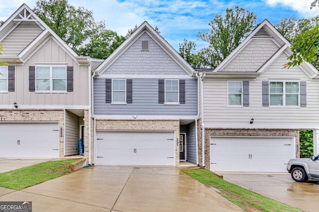 3426 Abbey Way, Gainesville, GA 30507 - view of property with a garage, brick siding, and driveway