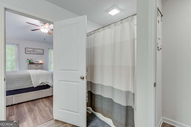 3426 Abbey Way, Gainesville, GA 30507 - full bathroom featuring connected bathroom, wood finished floors, a ceiling fan, and a shower with curtain