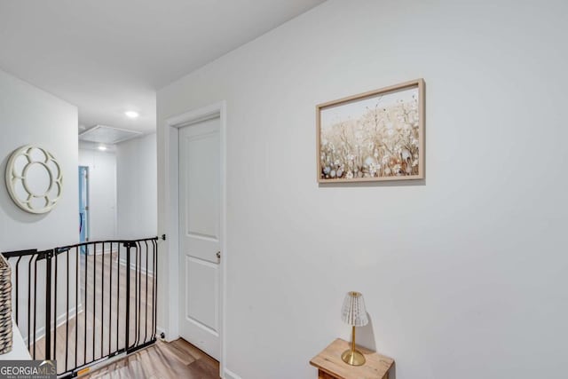 3426 Abbey Way, Gainesville, GA 30507 - hallway featuring attic access, wood finished floors, an upstairs landing, recessed lighting, and baseboards