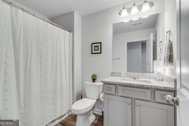 3426 Abbey Way, Gainesville, GA 30507 - bathroom with wood finished floors, toilet, and vanity