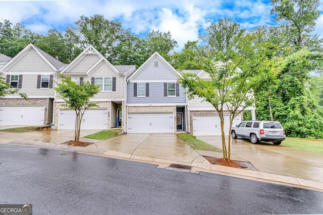 3426 Abbey Way, Gainesville, GA 30507 - view of property with an attached garage, concrete driveway, and board and batten siding