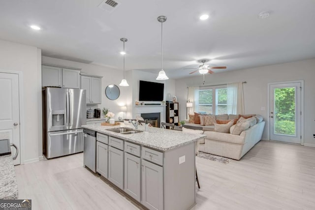 3426 Abbey Way, Gainesville, GA 30507 - kitchen featuring stainless steel appliances, a sink, gray cabinetry, light stone countertops, and recessed lighting