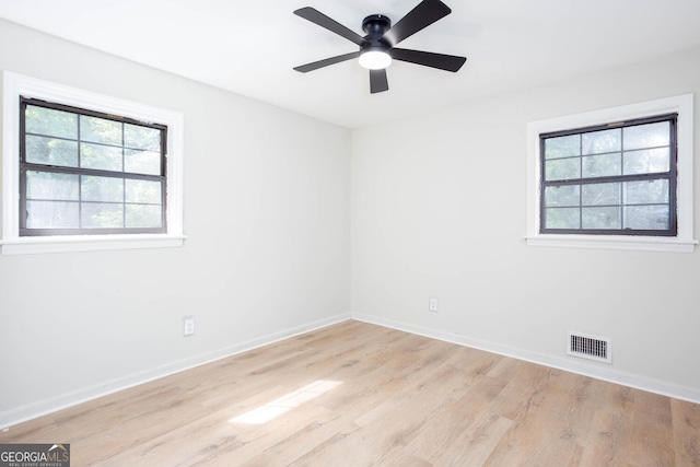 3193 Trasher Cir, Decatur, GA 30032 - unfurnished room featuring healthy amount of natural light, light wood-style flooring, and baseboards