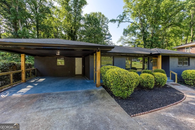 3193 Trasher Cir, Decatur, GA 30032 - view of front of house featuring driveway, brick siding, and an attached carport