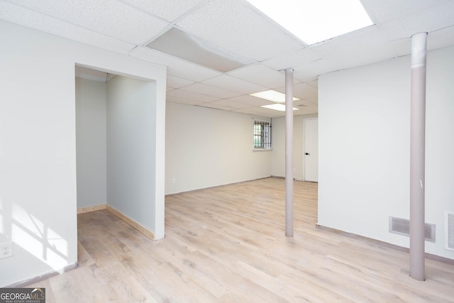 3193 Trasher Cir, Decatur, GA 30032 - basement featuring light wood-style floors, a drop ceiling, and baseboards