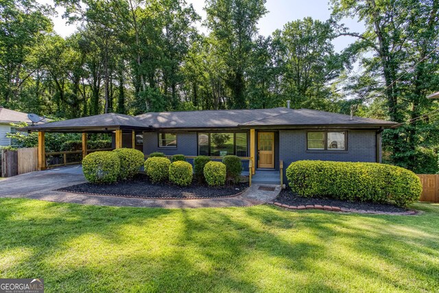 3193 Trasher Cir, Decatur, GA 30032 - view of front of house featuring asphalt driveway, an attached carport, and brick siding