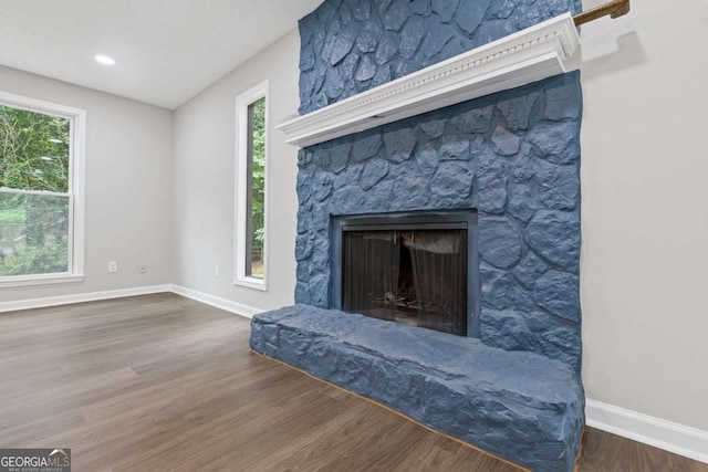 4657 Lou Ivy Rd, Peachtree Corners, GA 30096 - detailed view of a fireplace, wood finished floors, and baseboards