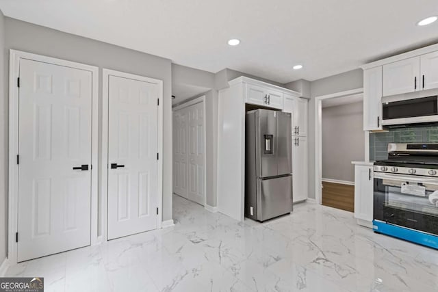 4657 Lou Ivy Rd, Peachtree Corners, GA 30096 - kitchen with appliances with stainless steel finishes, baseboards, white cabinets, light marble finish floors, and recessed lighting