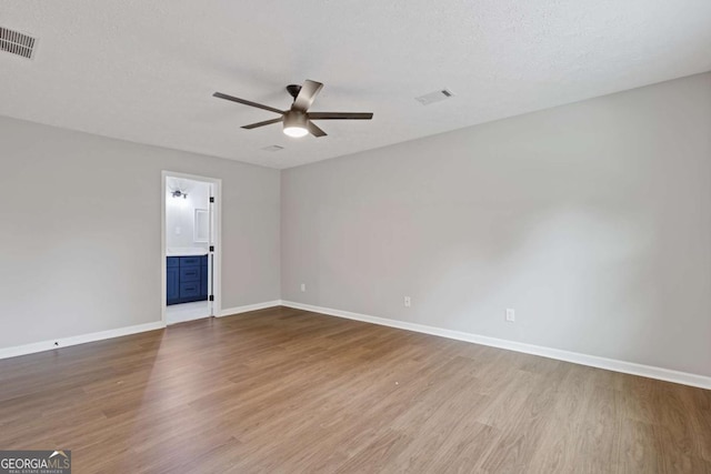 4657 Lou Ivy Rd, Peachtree Corners, GA 30096 - empty room featuring a ceiling fan, wood finished floors, and baseboards