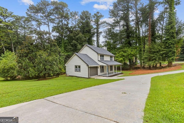 4657 Lou Ivy Rd, Peachtree Corners, GA 30096 - view of front of home with a porch, driveway, a front yard, a garage, and view of wooded area