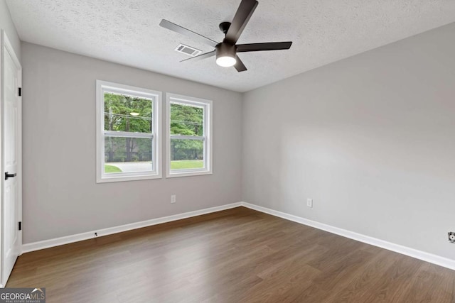 4657 Lou Ivy Rd, Peachtree Corners, GA 30096 - spare room with wood finished floors, ceiling fan, a textured ceiling, and baseboards
