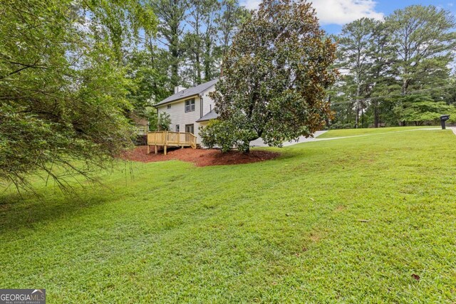 4657 Lou Ivy Rd, Peachtree Corners, GA 30096 - view of grassy yard featuring a deck