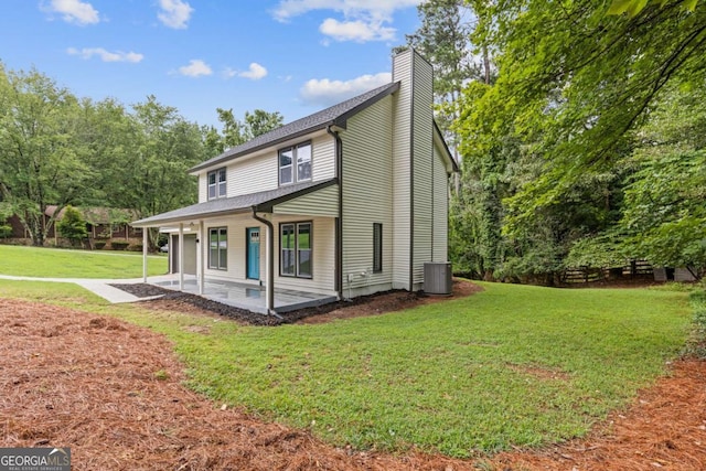 4657 Lou Ivy Rd, Peachtree Corners, GA 30096 - view of side of property featuring cooling unit, a yard, a chimney, and a patio