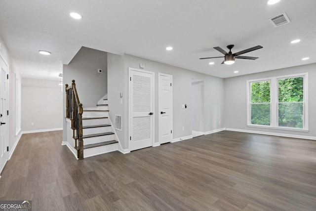 4657 Lou Ivy Rd, Peachtree Corners, GA 30096 - unfurnished living room featuring ceiling fan, stairway, wood finished floors, recessed lighting, and baseboards