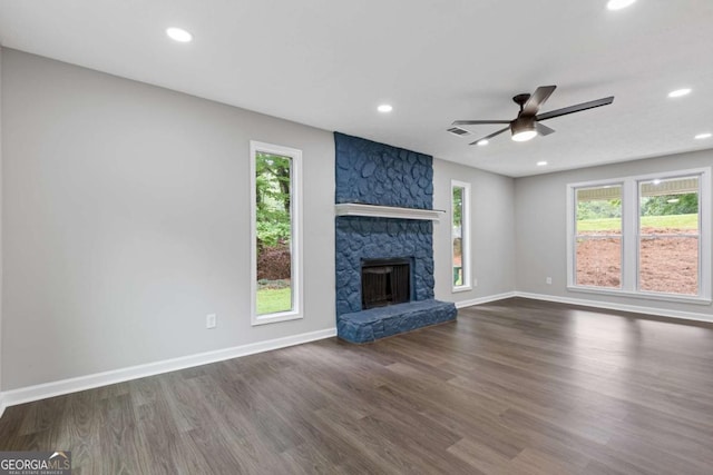 4657 Lou Ivy Rd, Peachtree Corners, GA 30096 - unfurnished living room with healthy amount of natural light, ceiling fan, dark wood-type flooring, a fireplace, and recessed lighting
