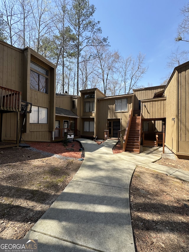 view of community featuring stairs