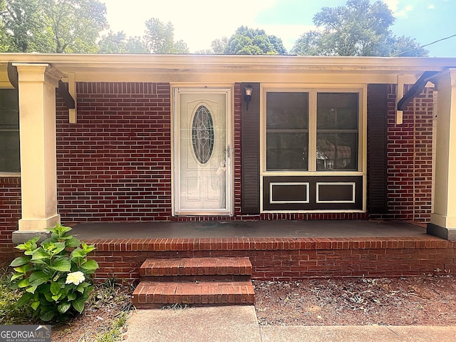 210 Sanders Rd, Athens, GA 30605 - view of exterior entry with a porch and brick siding