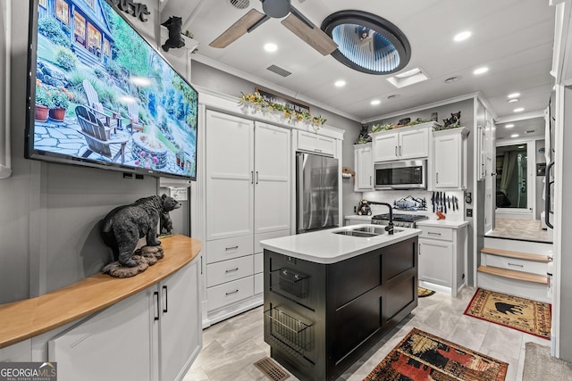 344 Choestoe Falls Cir, Blairsville, GA 30512 - kitchen featuring stainless steel appliances, a sink, light countertops, white cabinets, and ornamental molding