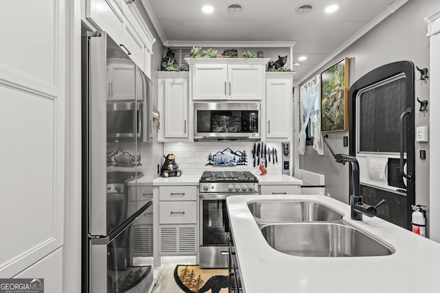 344 Choestoe Falls Cir, Blairsville, GA 30512 - kitchen featuring appliances with stainless steel finishes, a sink, light countertops, white cabinetry, and crown molding