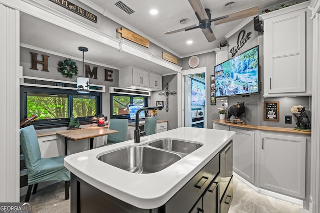 344 Choestoe Falls Cir, Blairsville, GA 30512 - kitchen featuring a sink, ceiling fan, white cabinetry, light countertops, and a center island with sink