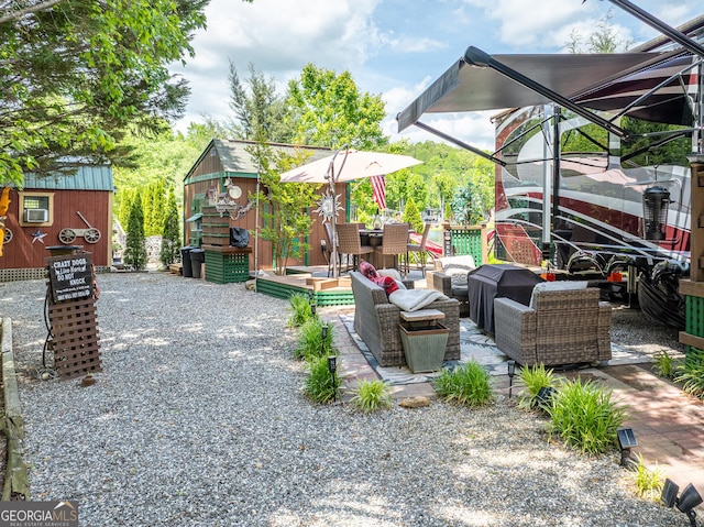 344 Choestoe Falls Cir, Blairsville, GA 30512 - view of patio with outdoor dining space, an outbuilding, and a wooden deck