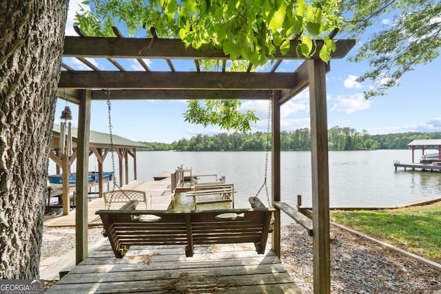 dock area with a water view and boat lift