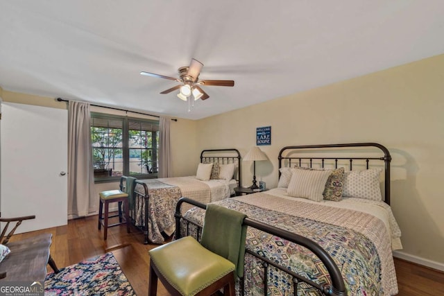 bedroom featuring wood finished floors and a ceiling fan