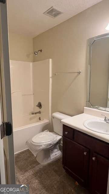 7055 Blairs View Dr Unit 1, Austell, GA 30168 - bathroom featuring vanity, toilet, and shower / bathtub combination